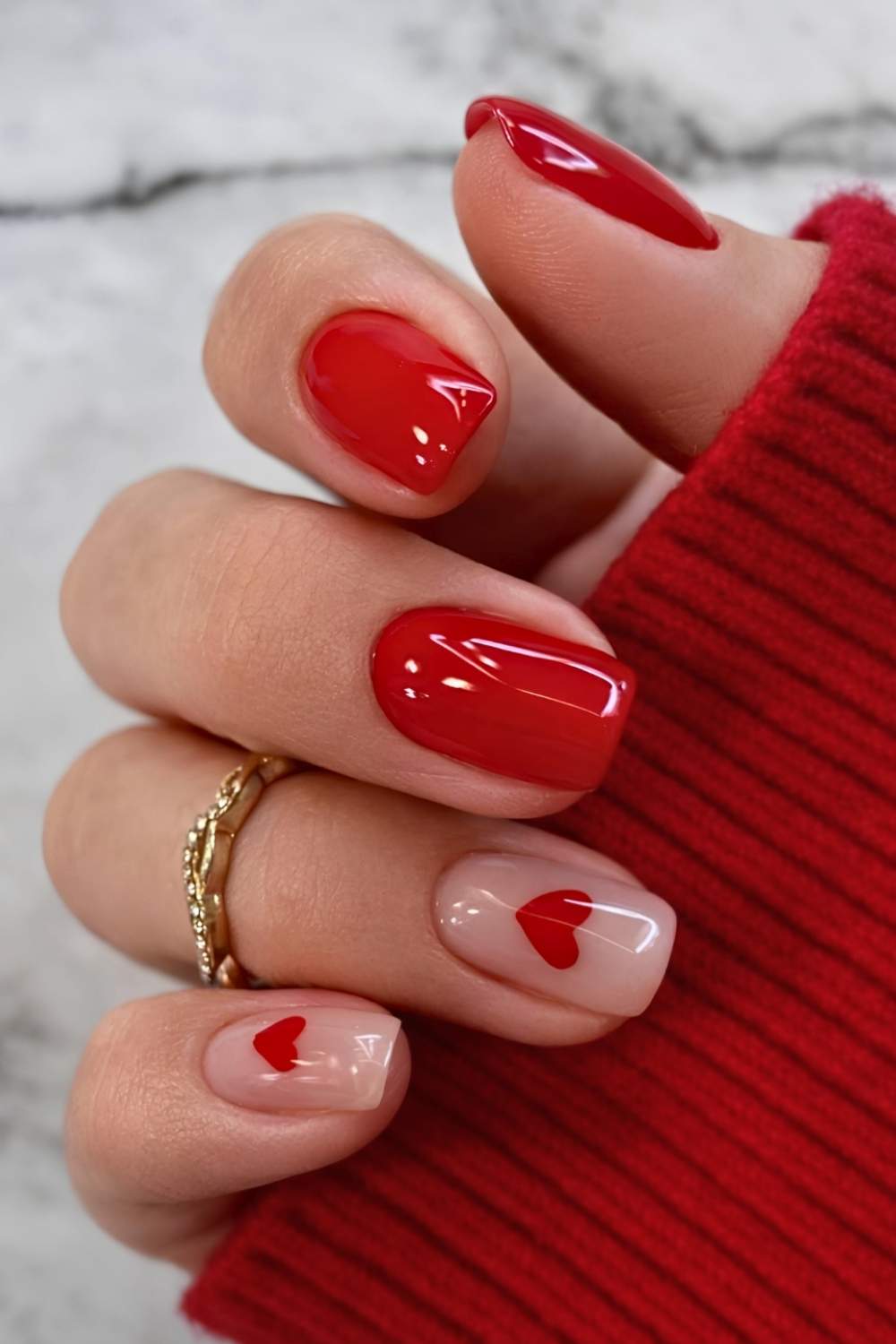 Red and sheer nails with accent hearts