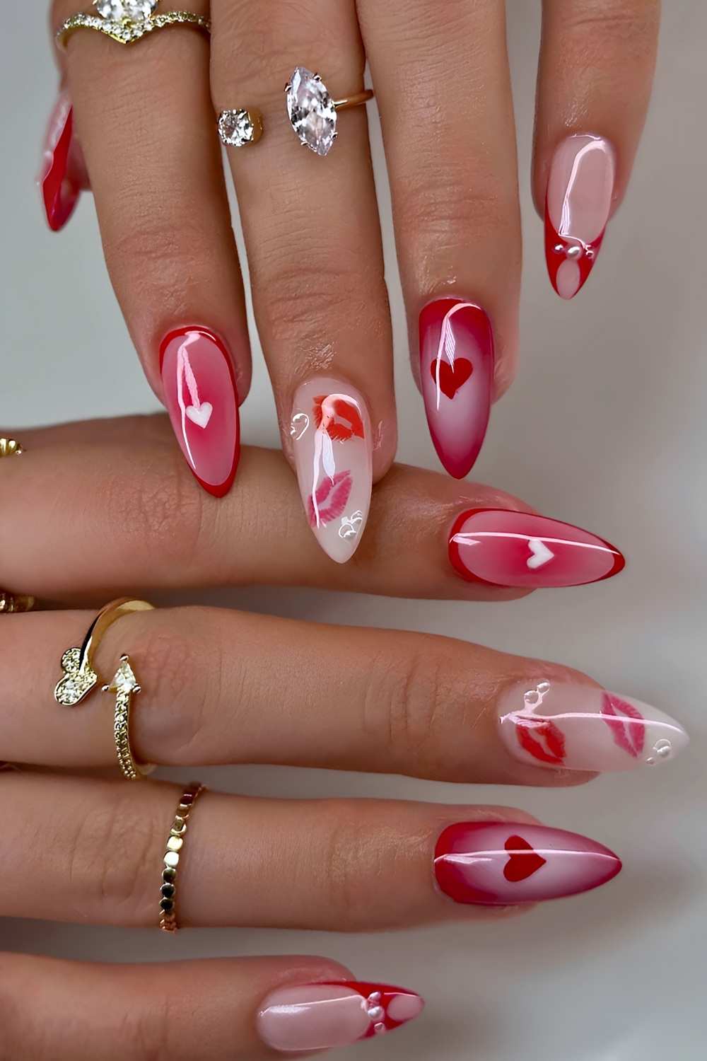 Red and white nails with aura and kiss art