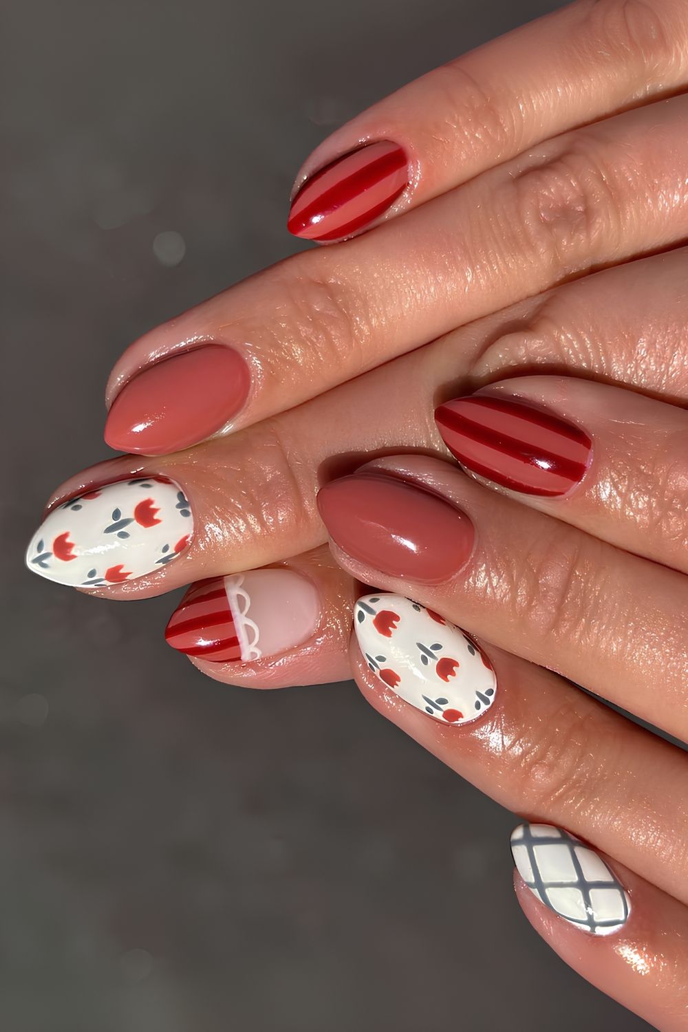 Red and white nails with stripes and flowers