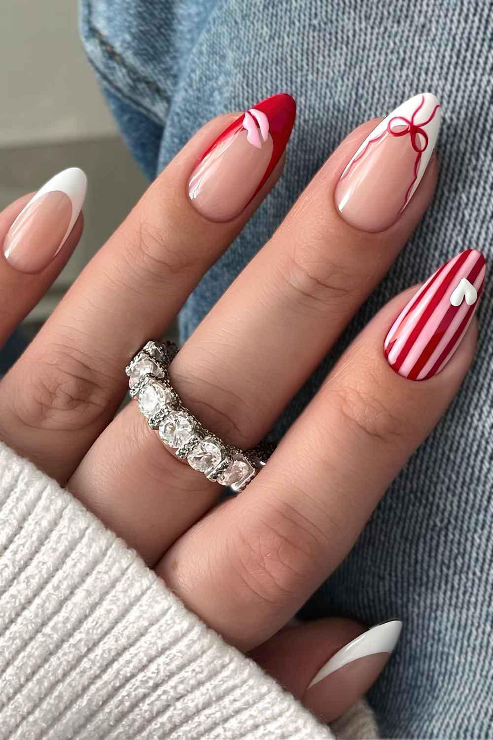 Red and white nails with stripes and hearts