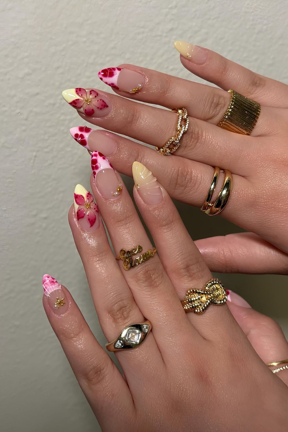 Red and yellow French mani with sculpted florals and raised details