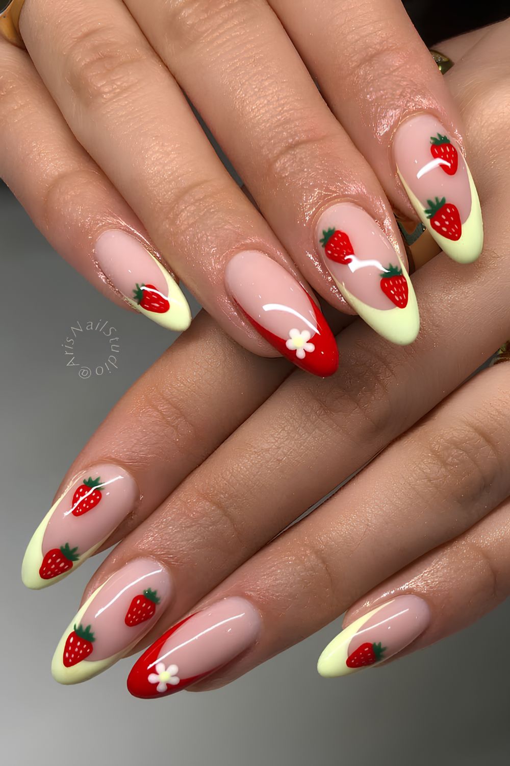 Red and yellow French mani with strawberries