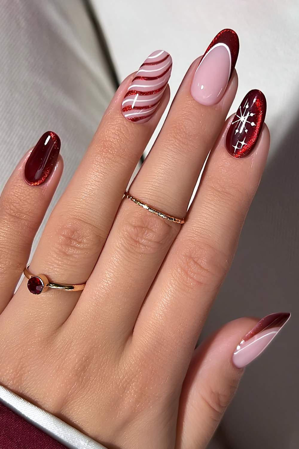 Red cat eye nails with winter holiday art