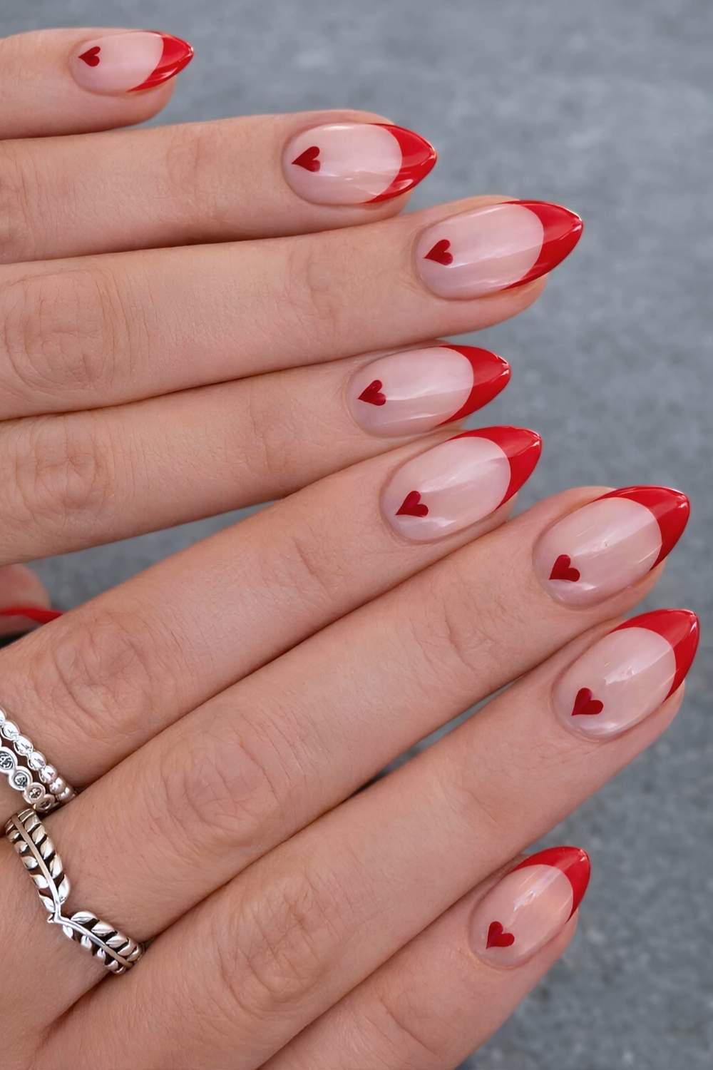 Red french nails with cuticle heart art