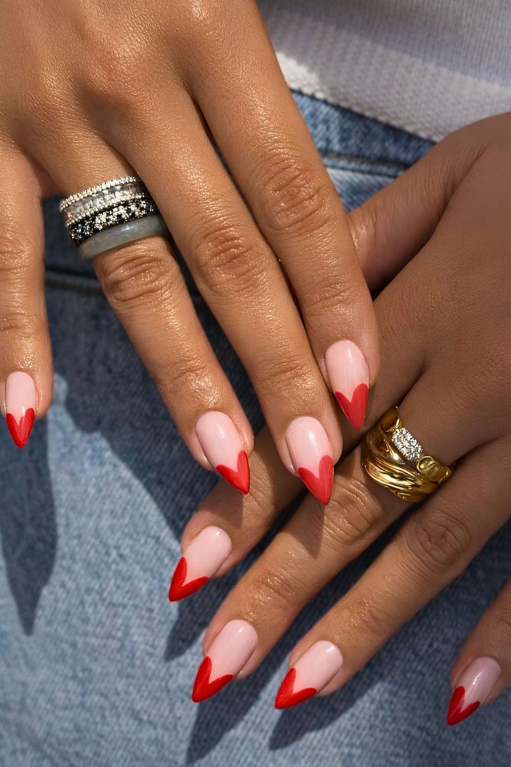 Red heart shaped French tip nail design