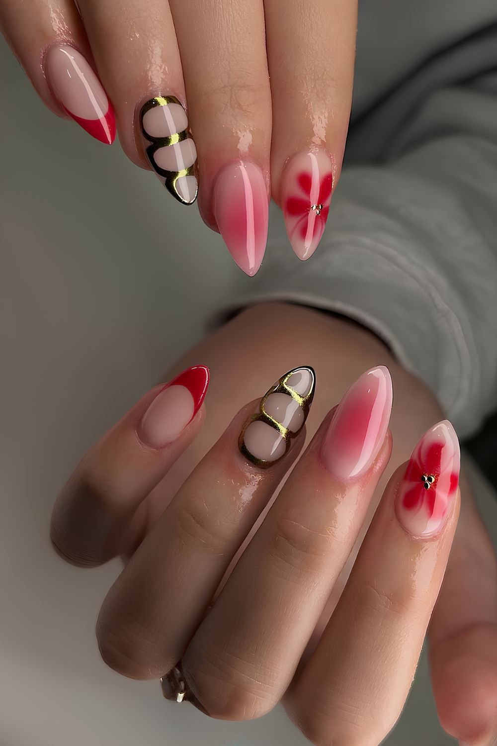Red mix and match nails with metallic details