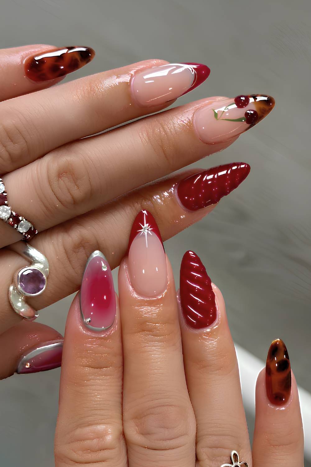 Red nails with 3D cherry accents
