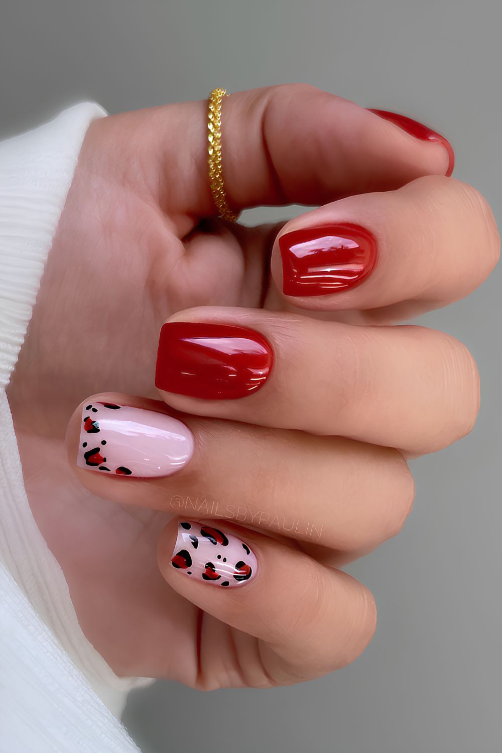 Red nails with black leopard spot patterns