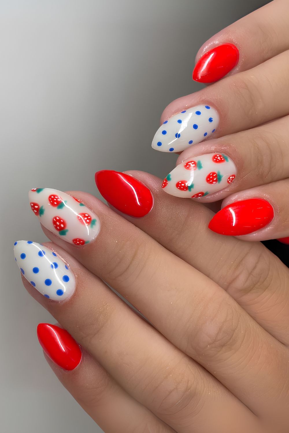 Red nails with blue dots and fruit art