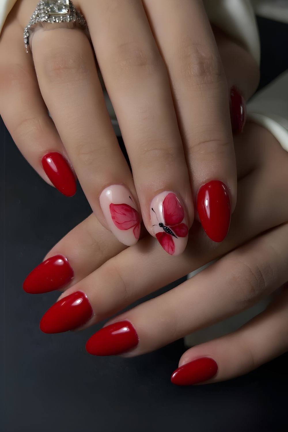 Red nails with butterfly art