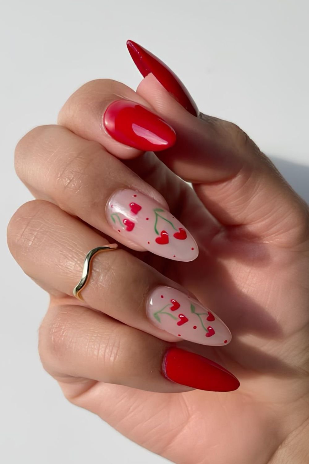 Red nails with cherry and dot accents