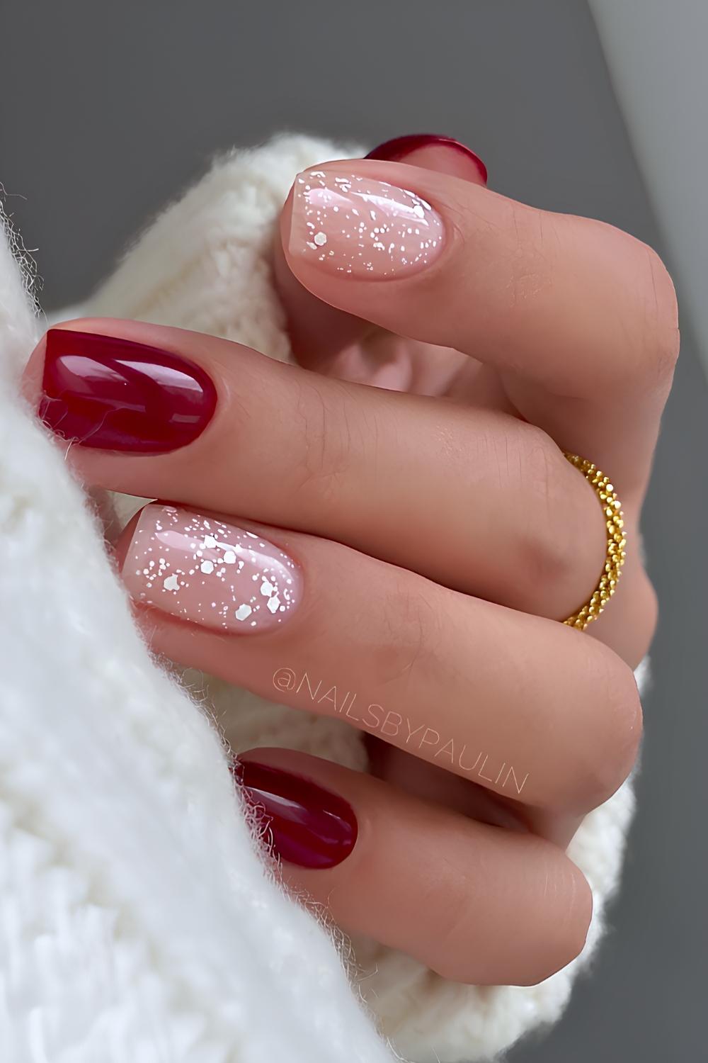 Red winter nails with snowy art