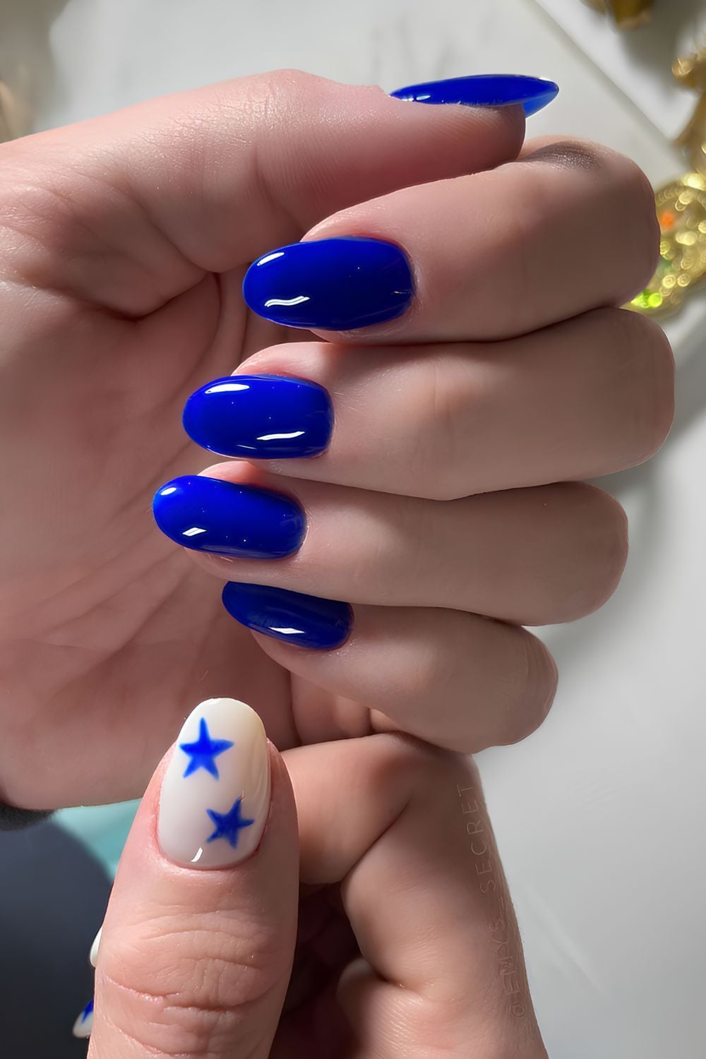 Royal blue mani with star accents