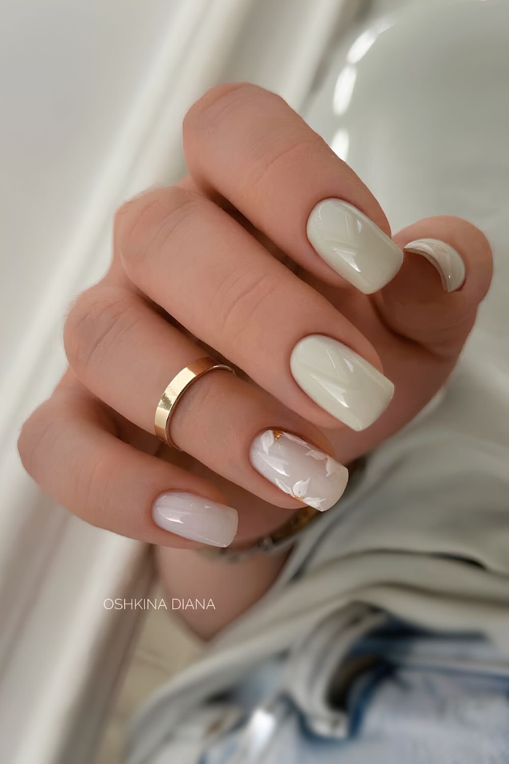 Sage green nails with daisy art