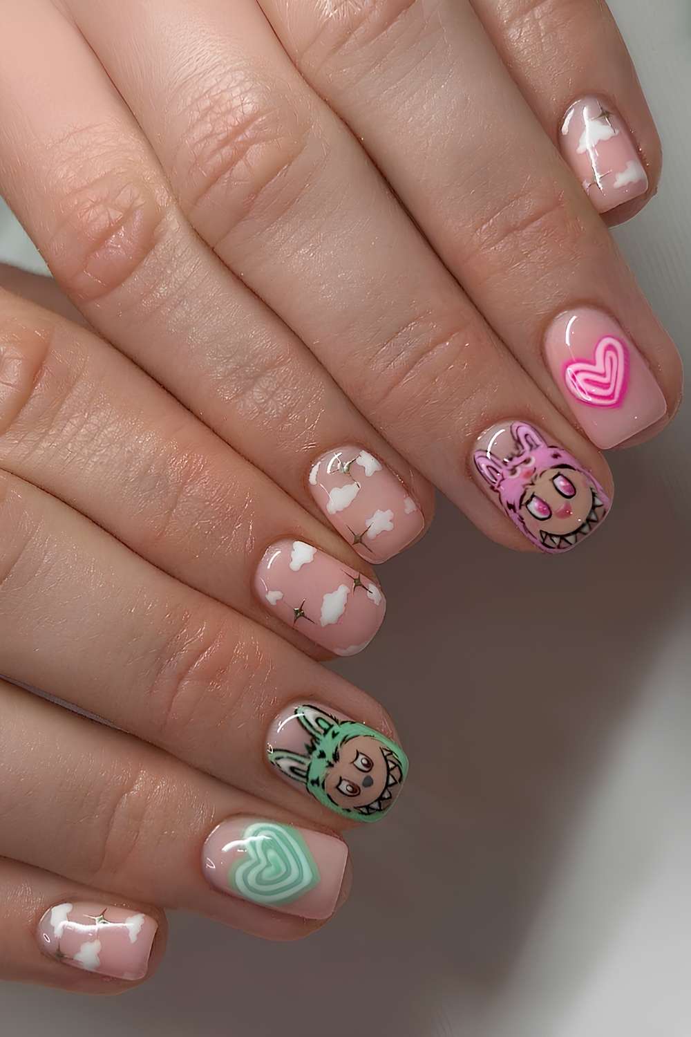 Sheer nails with Labubu inspired designs