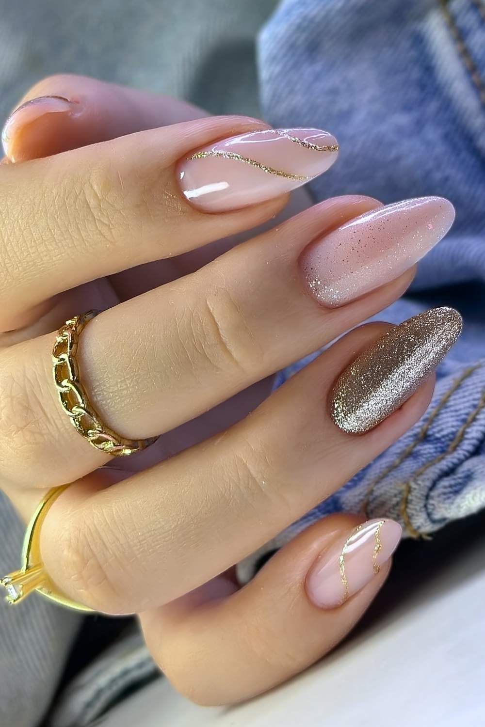 Sheer nails with gold glitter and line art