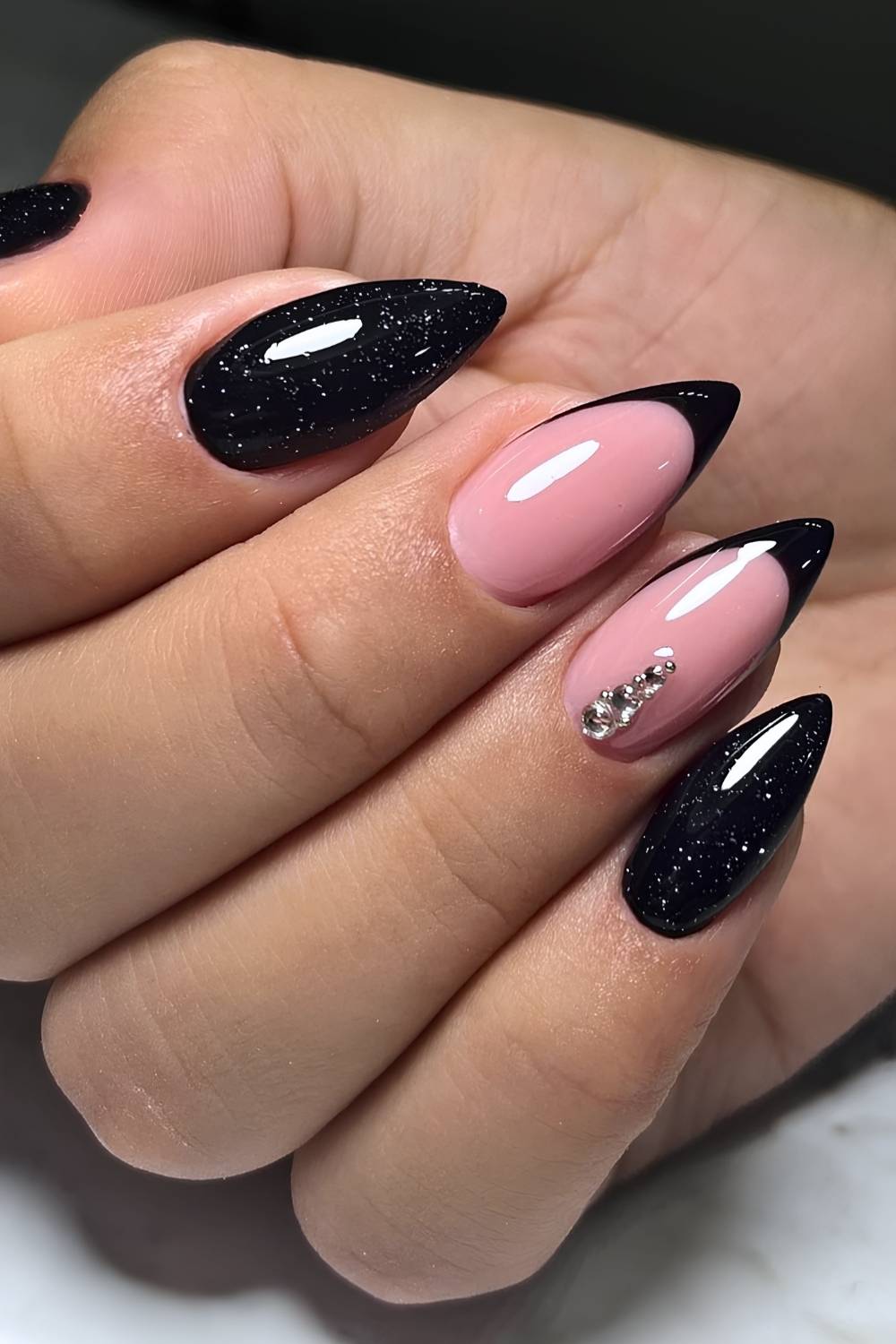 Shimmery black mani with gem accents