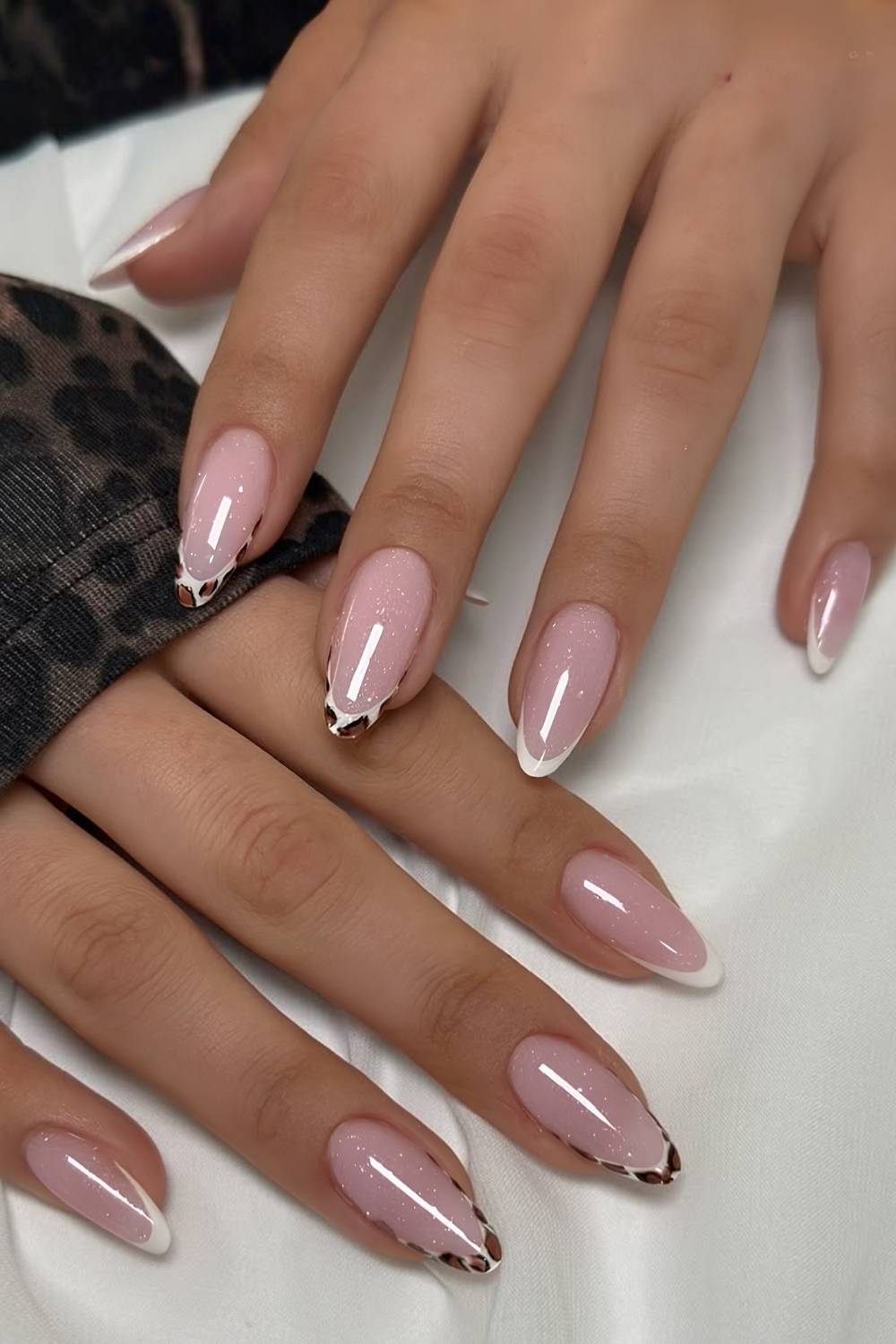 Shimmery white French mani with leopard print details