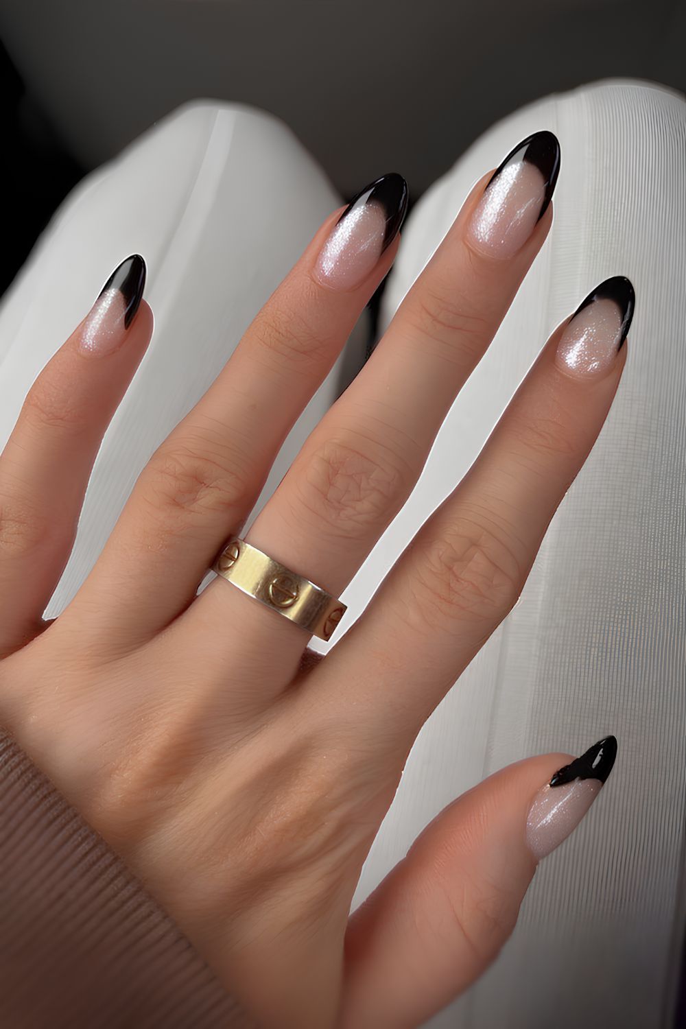 Shimmery white mani with black French tips