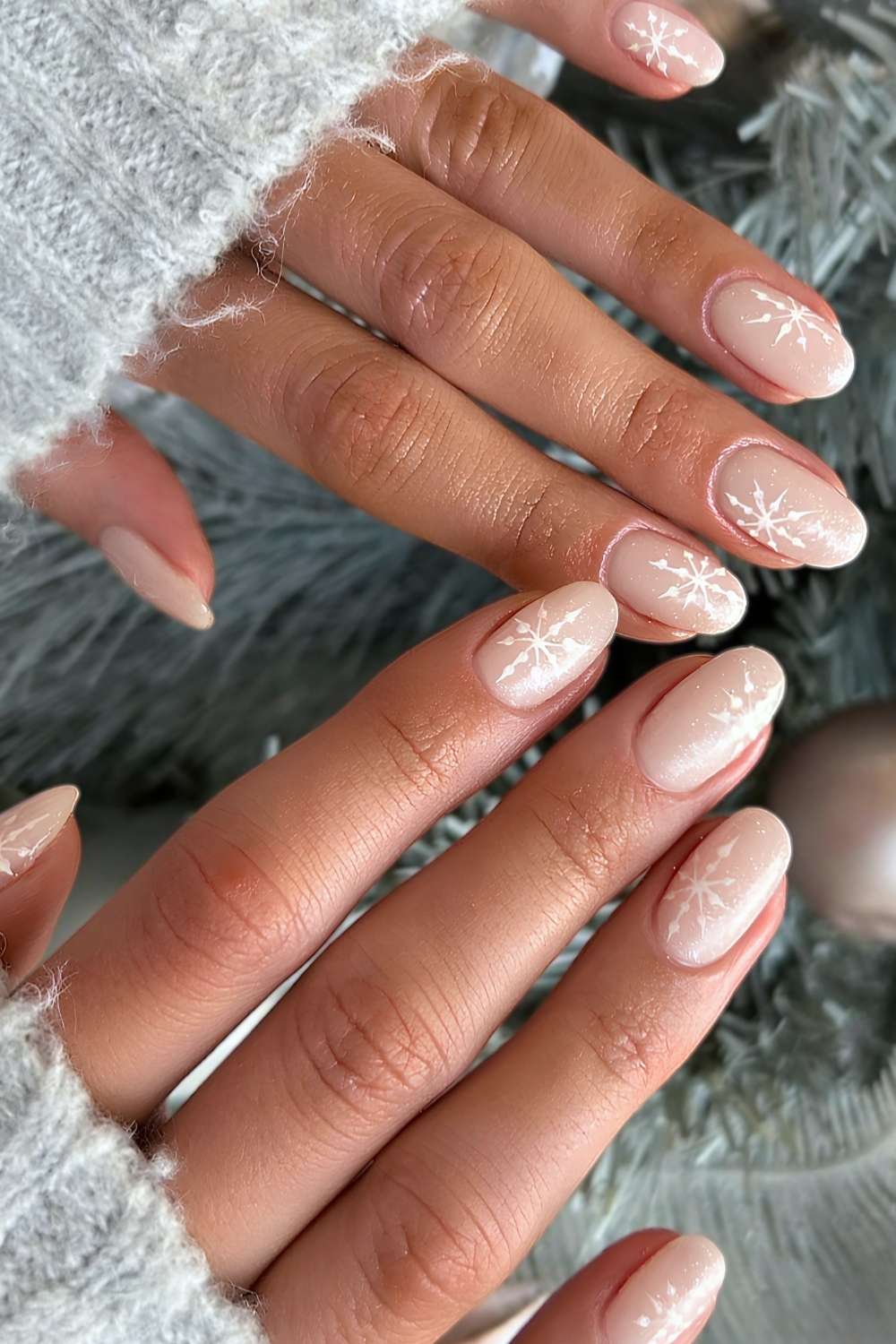 Shimmery white mani with snowflake art