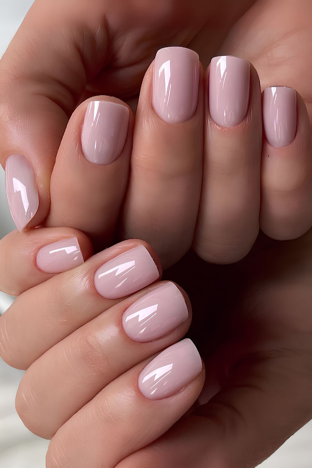 Short and glossy soft pink mani
