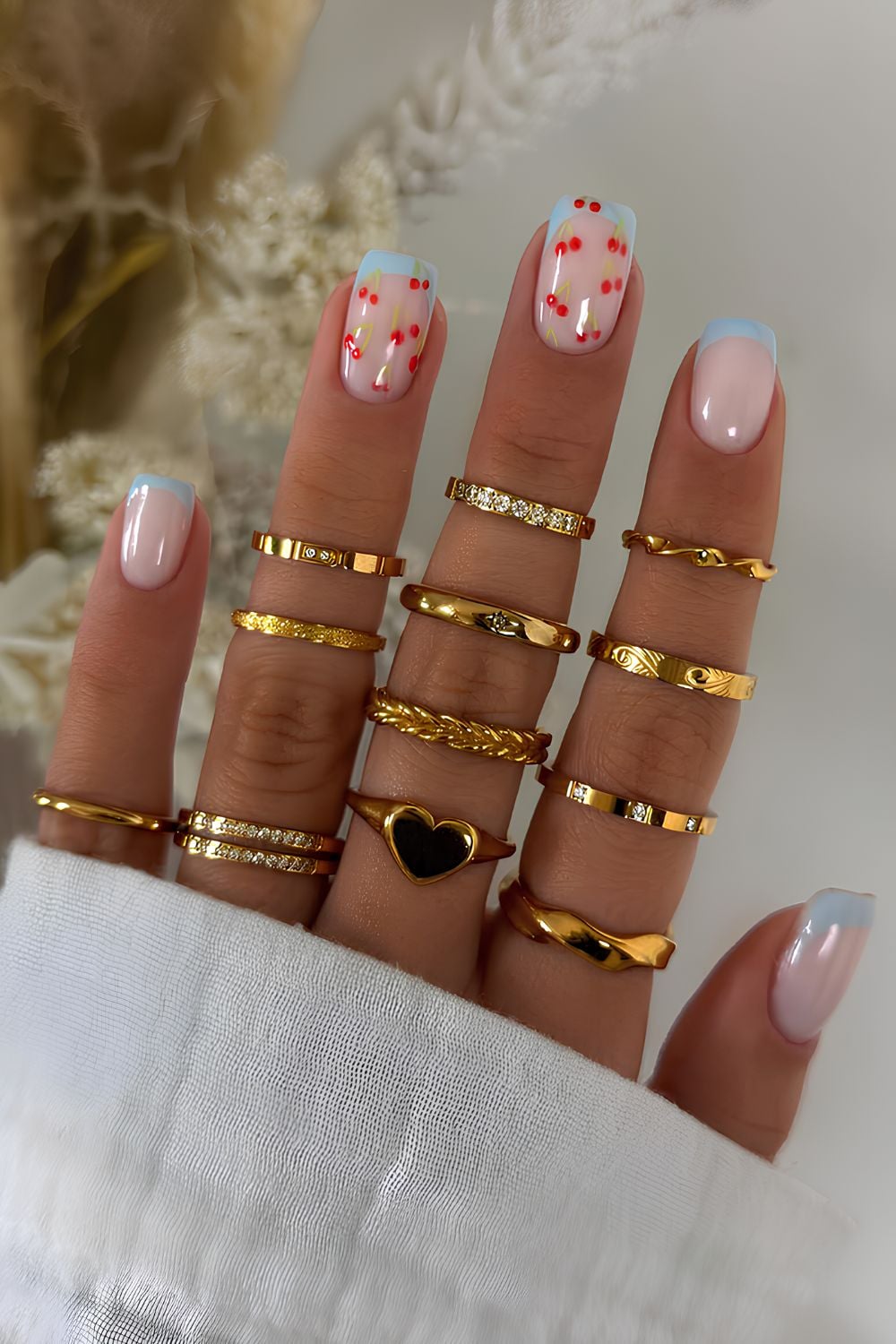 Short blue French mani with cherries