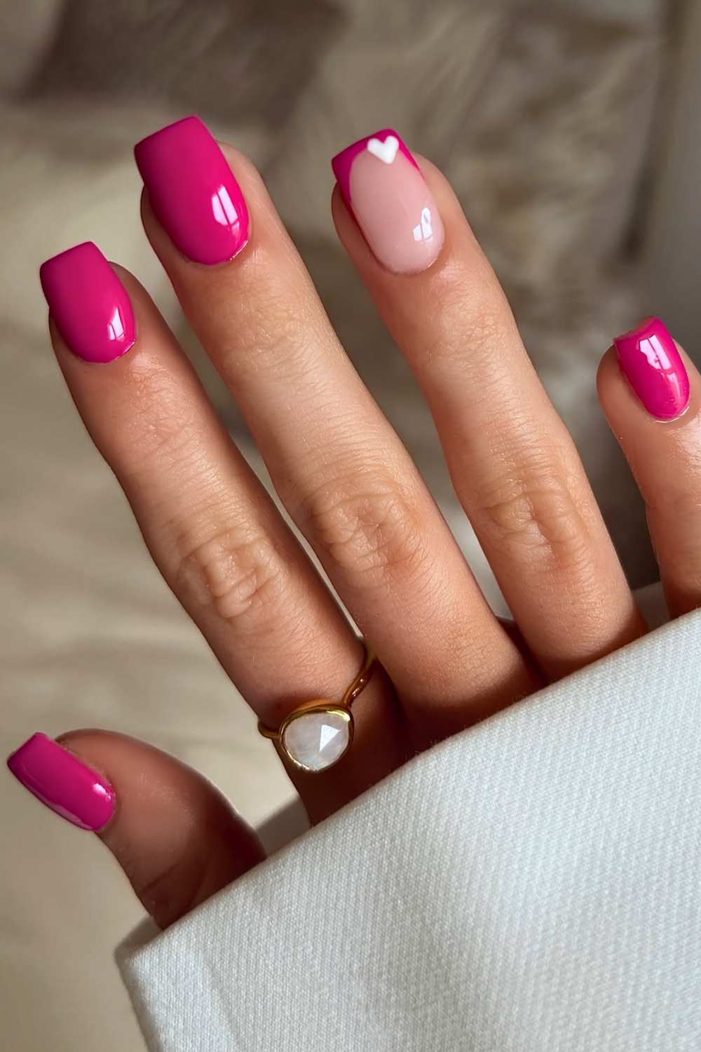 Short hot pink nails with hearts