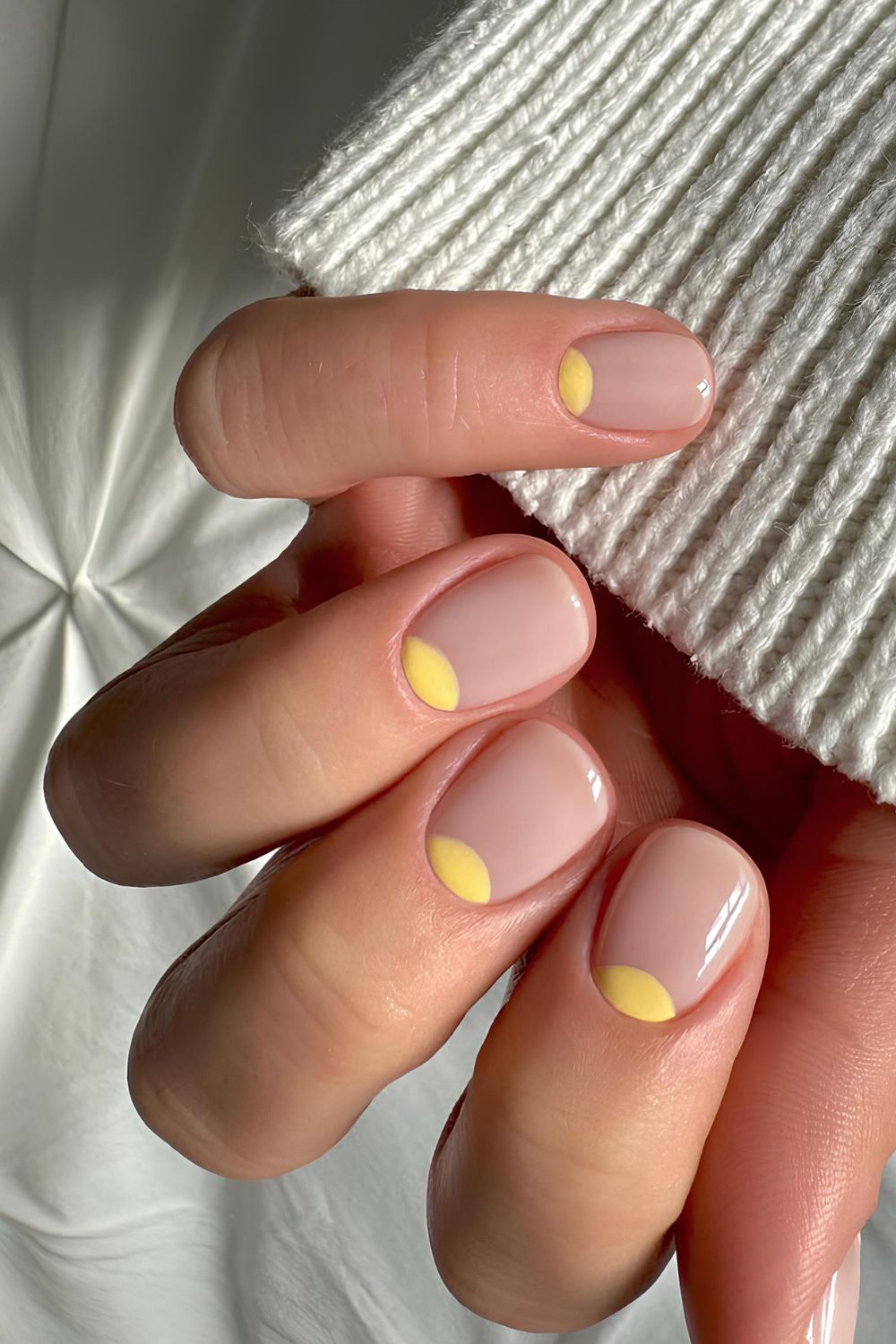 Short neutral nails with yellow half moons