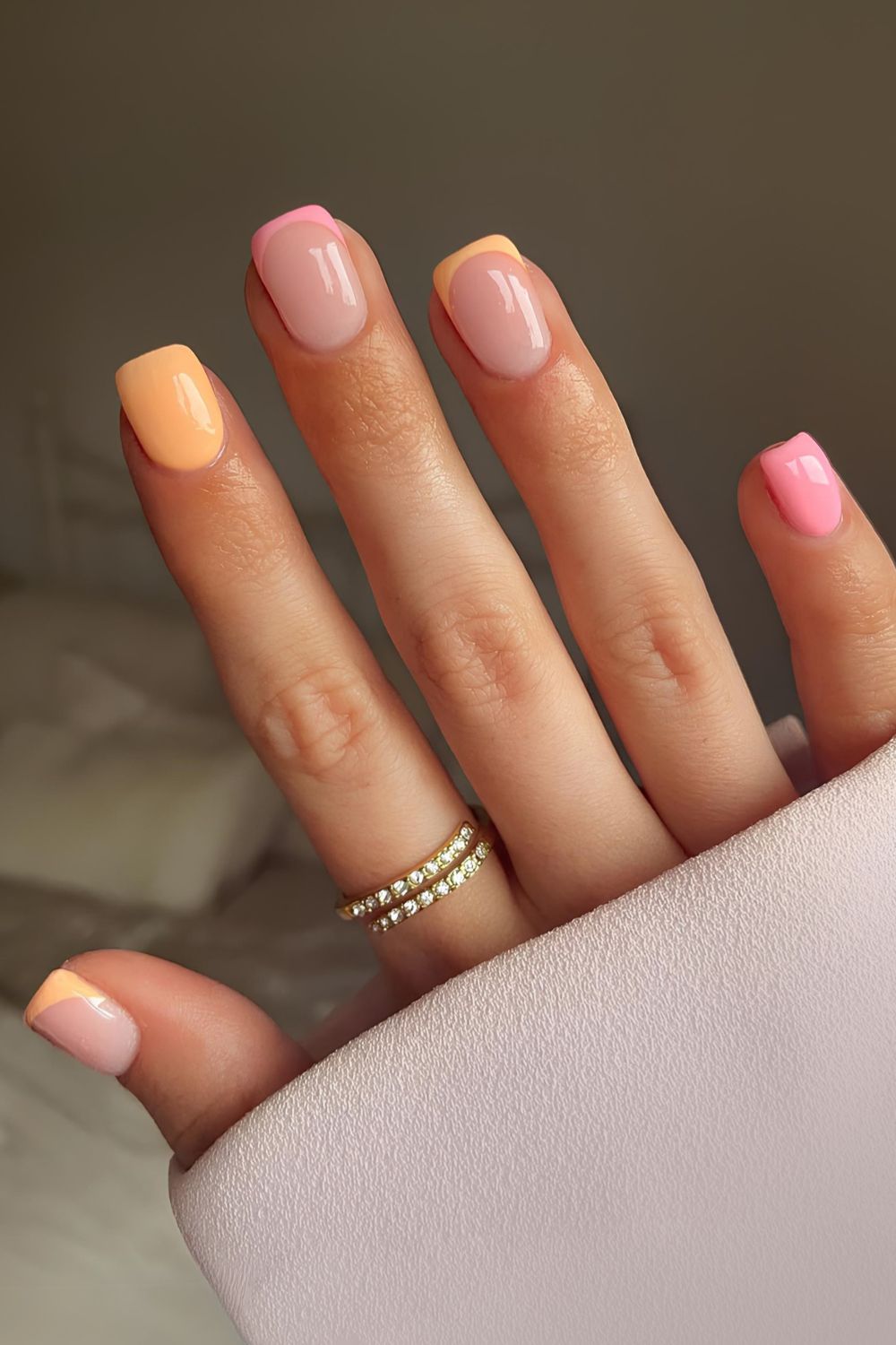Short peach and orange nails