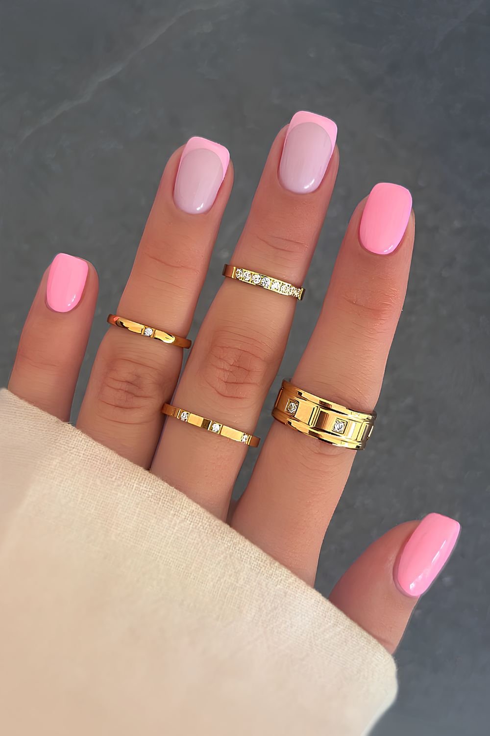 Short pink nails with accent French tips