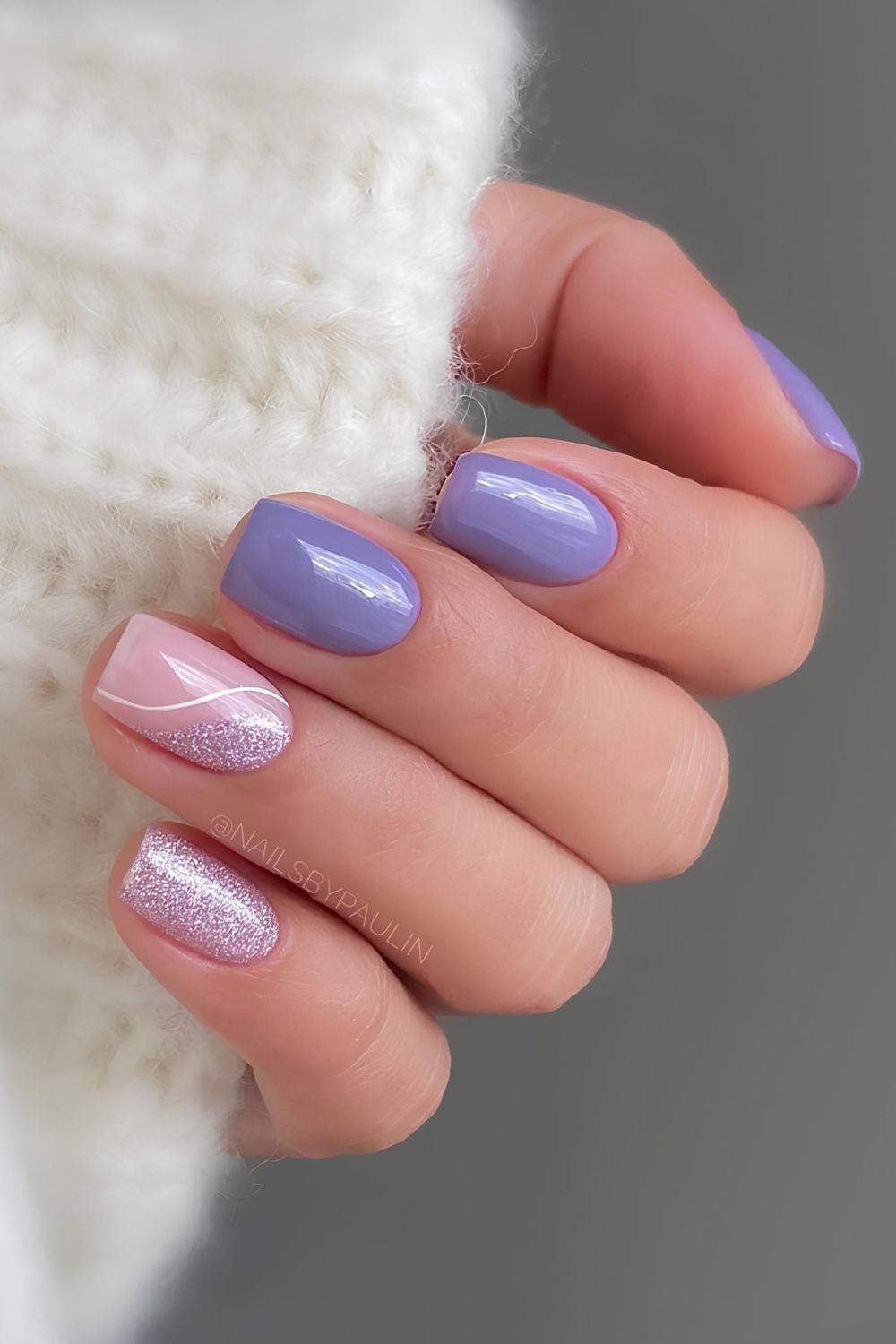 Short purple nails with glitter accents