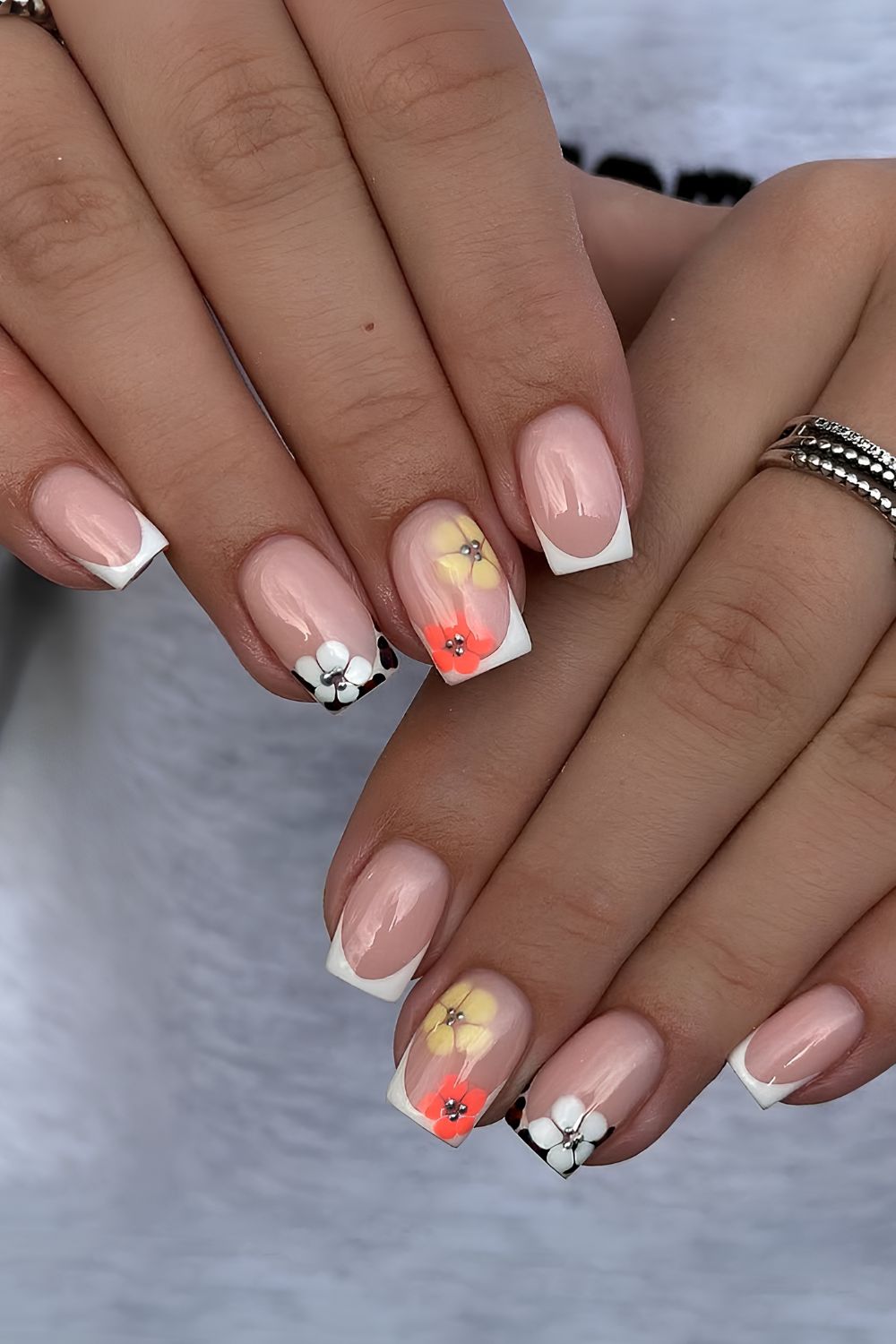 Short white French mani with flowers and animal print