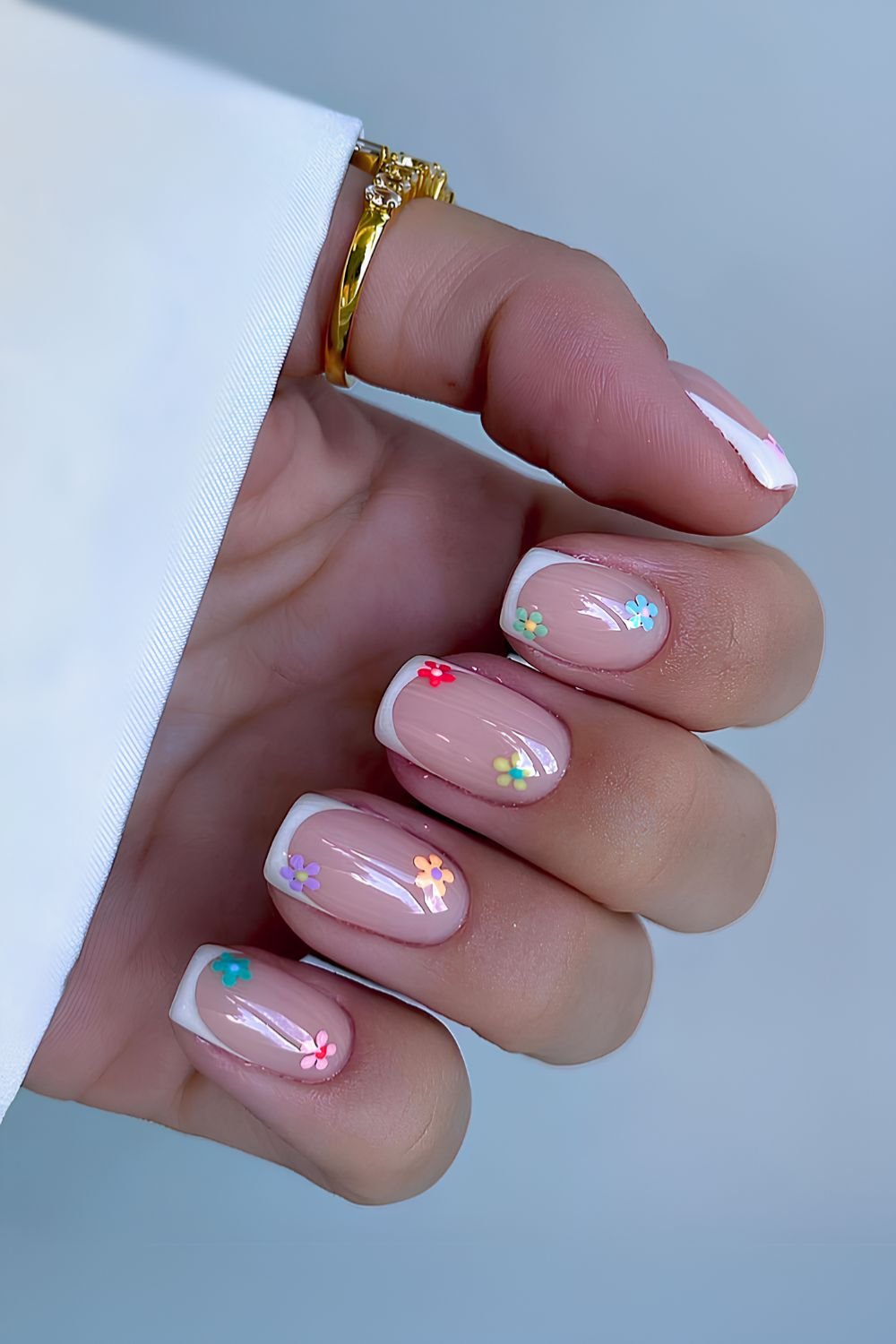 Short white French mani with flowers