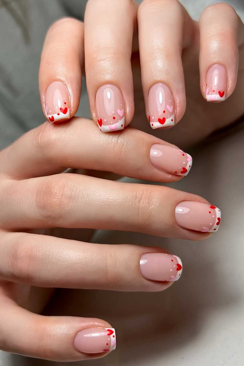 Short white French mani with heart art