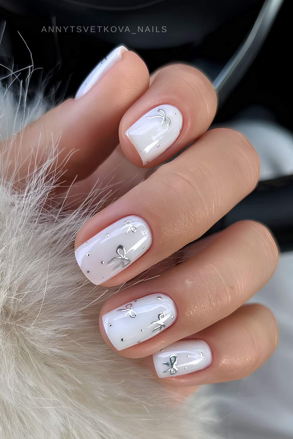 Short white nails with silver bows