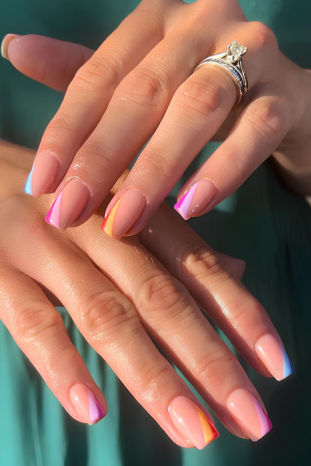 Side French tip mani with colorful stripes