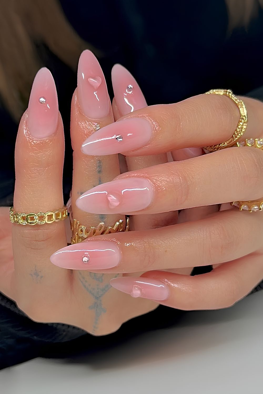 Soft pink jelly nails with hearts and gems