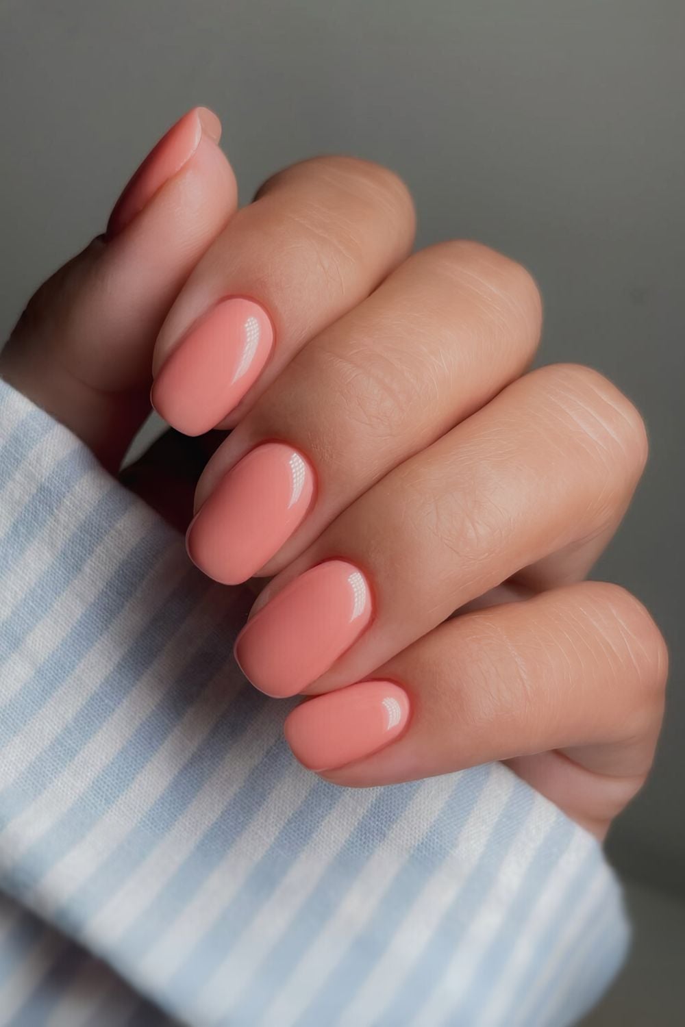 Solid coral peach manicure