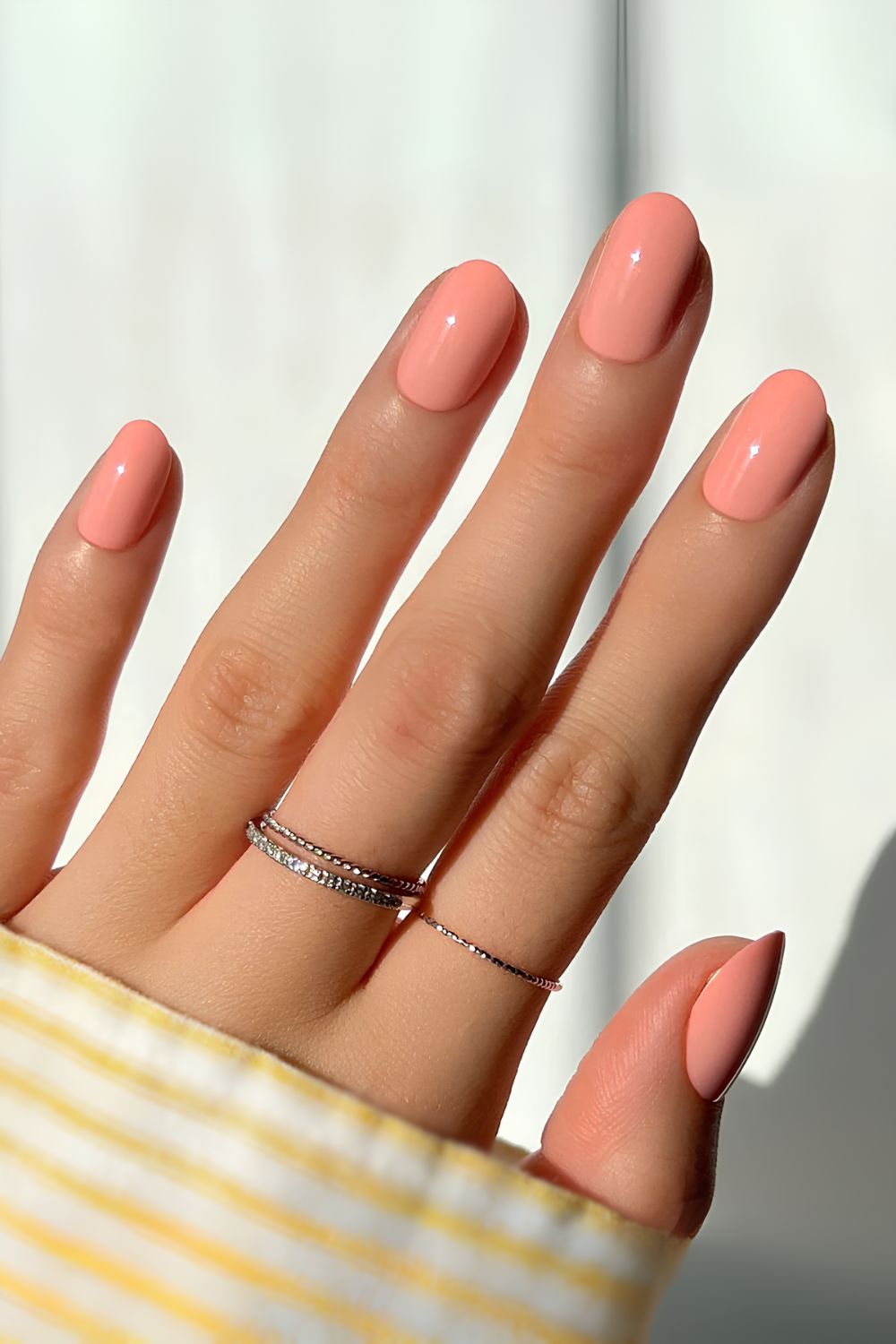 Solid coral peach manicure