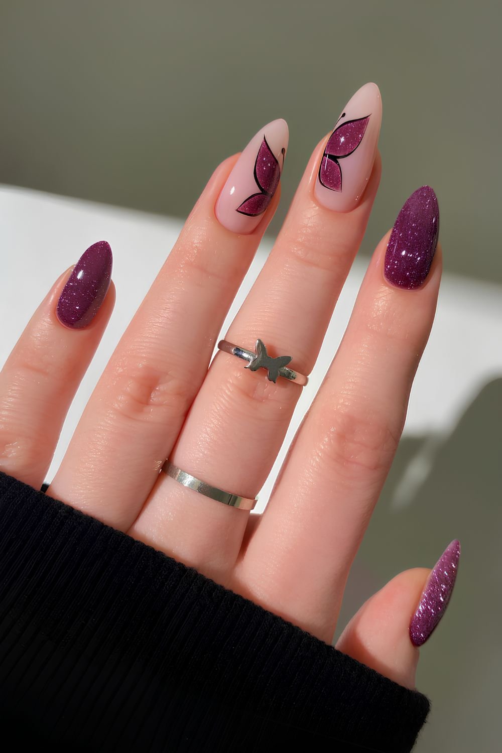 Sparkly plum nails with butterflies