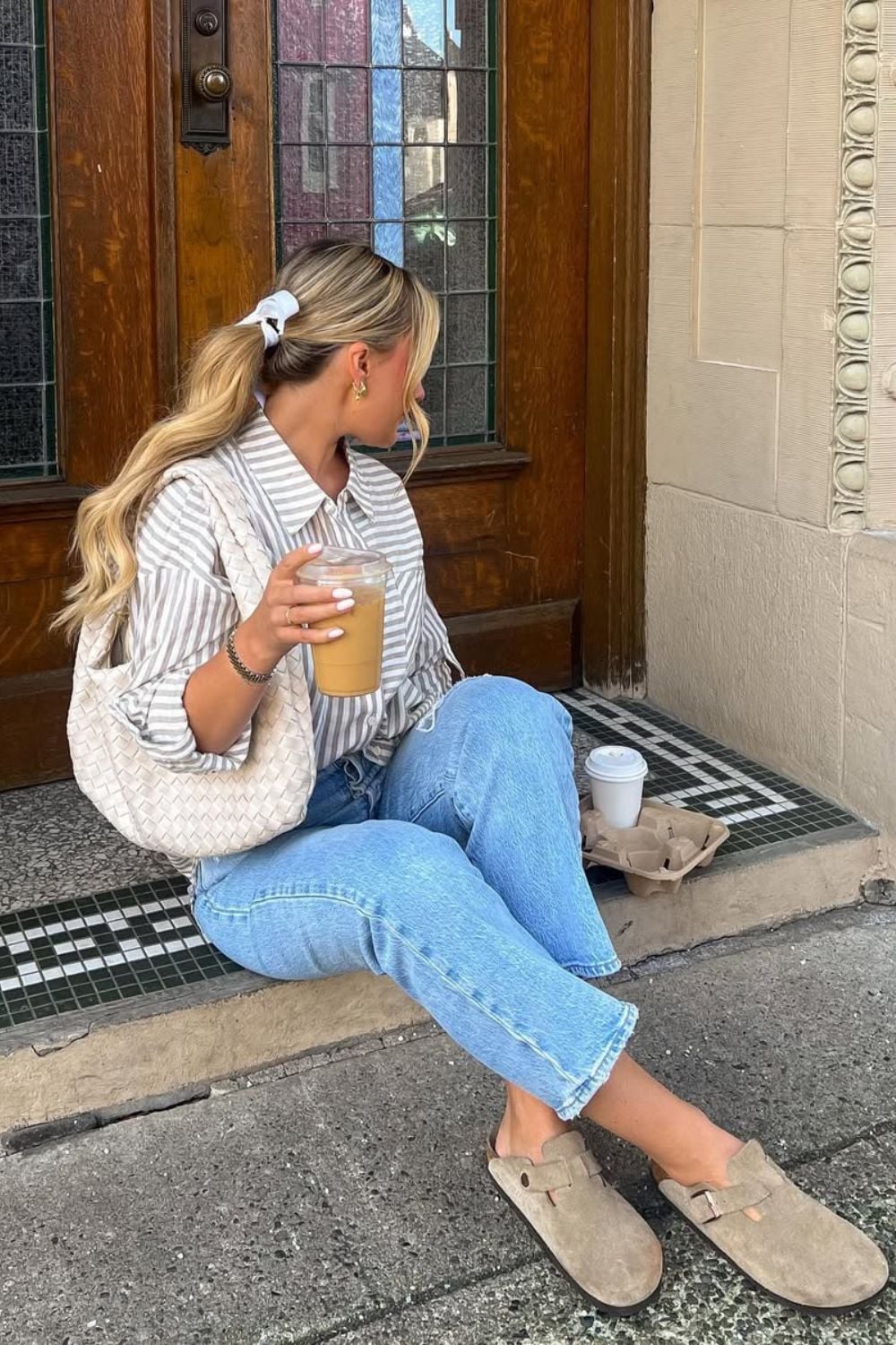 Stripped shirt and light wash jeans and clogs