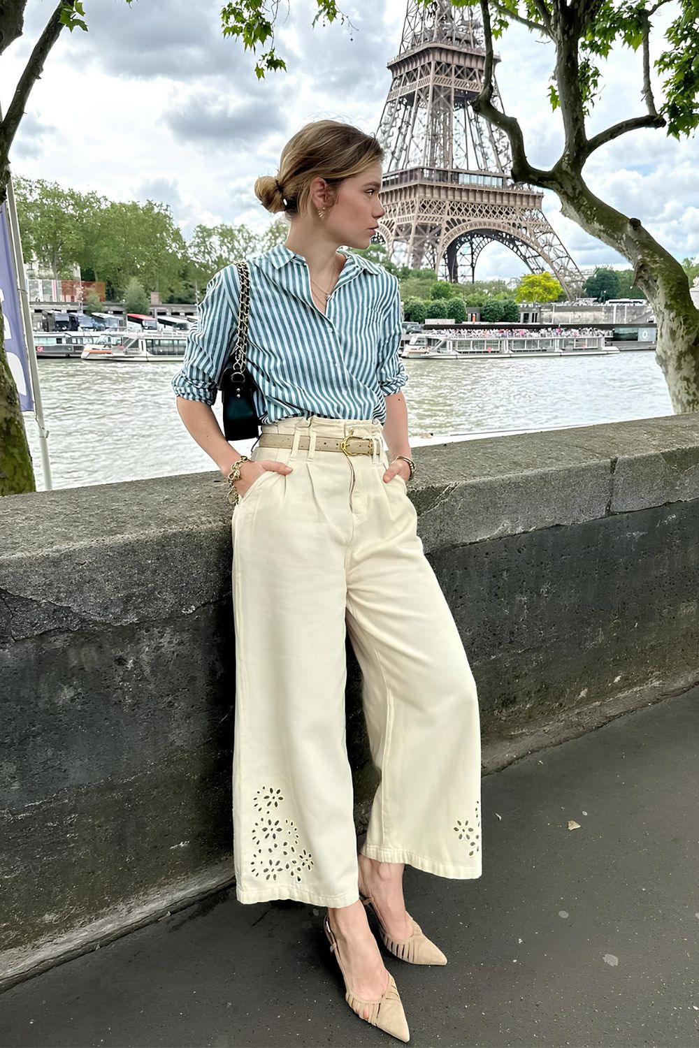 Stripped shirt paired with beige wide leg trousers