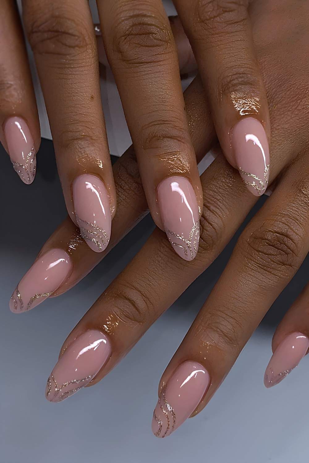 Swirly gold glitter French manicure