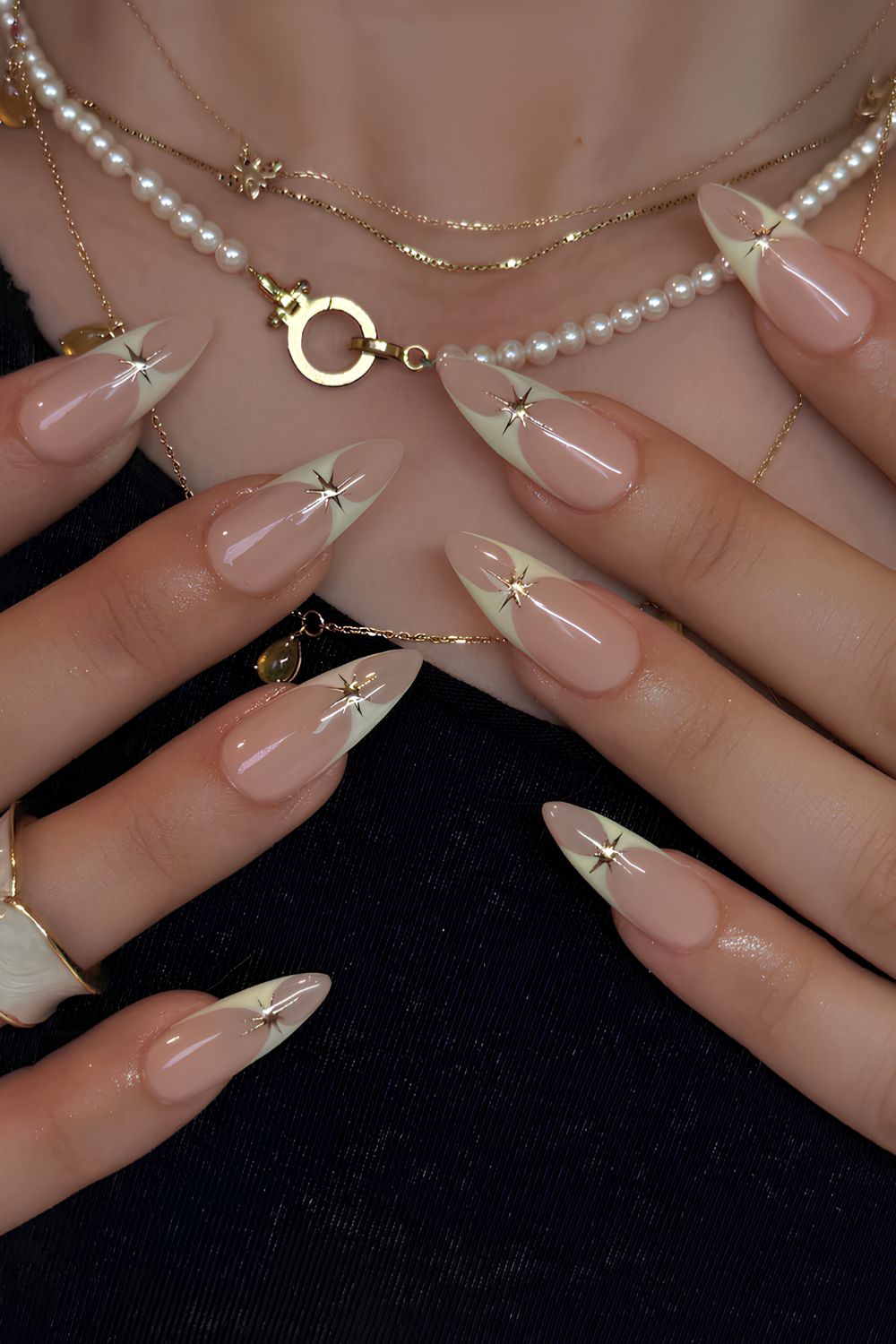Vanilla French manicure with celestial charms