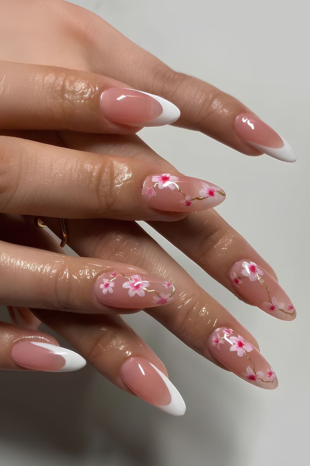 White Frencch manicure with cherry blossoms