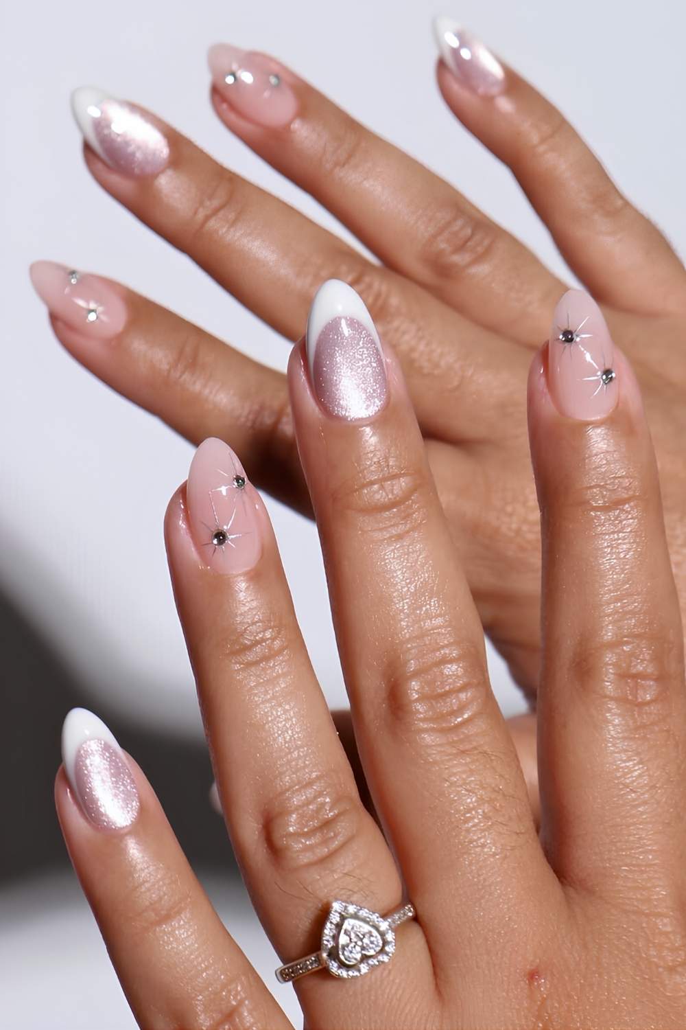 White French mani with accent cat eye and gems