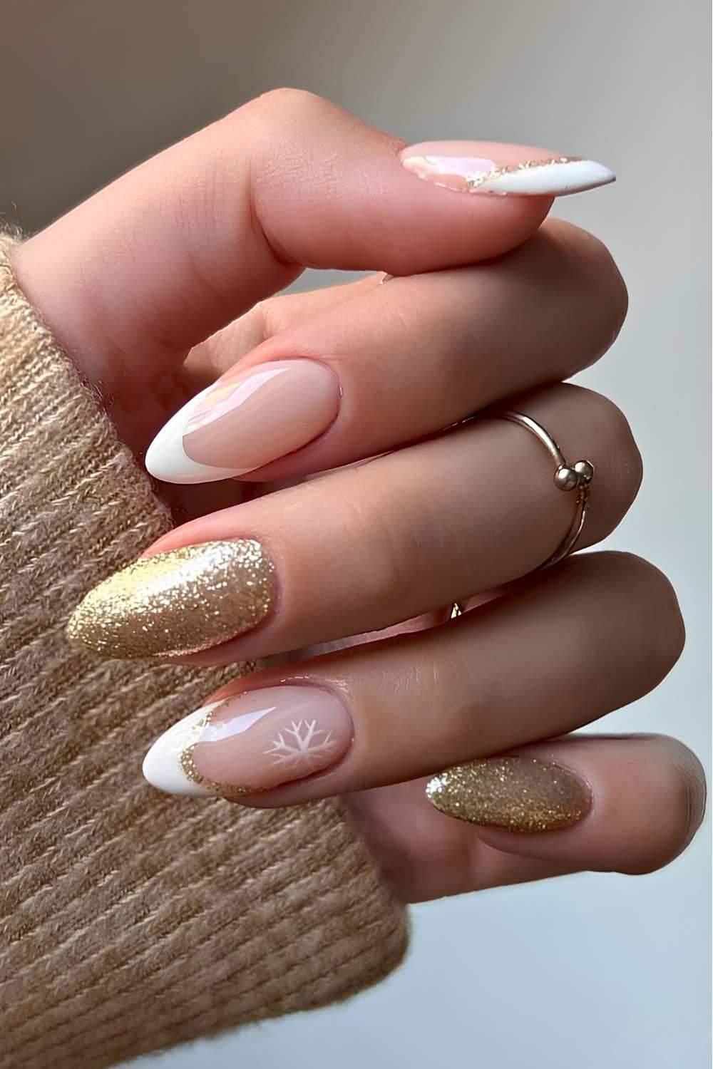 White French mani with gold glitter and snowflakes