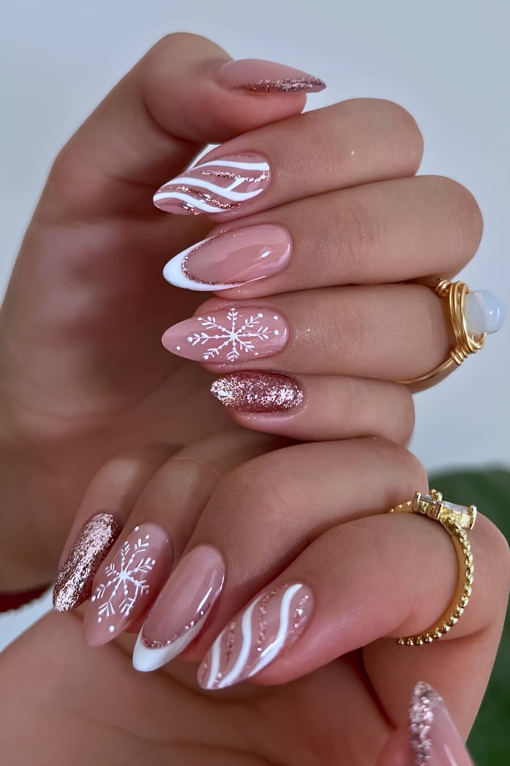 White French mani with rose gold glitter and snowflakes