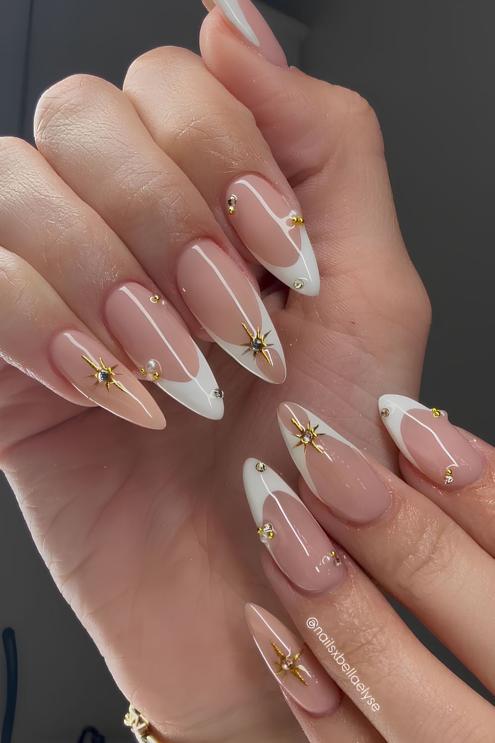 White French manicure with gold celestail details