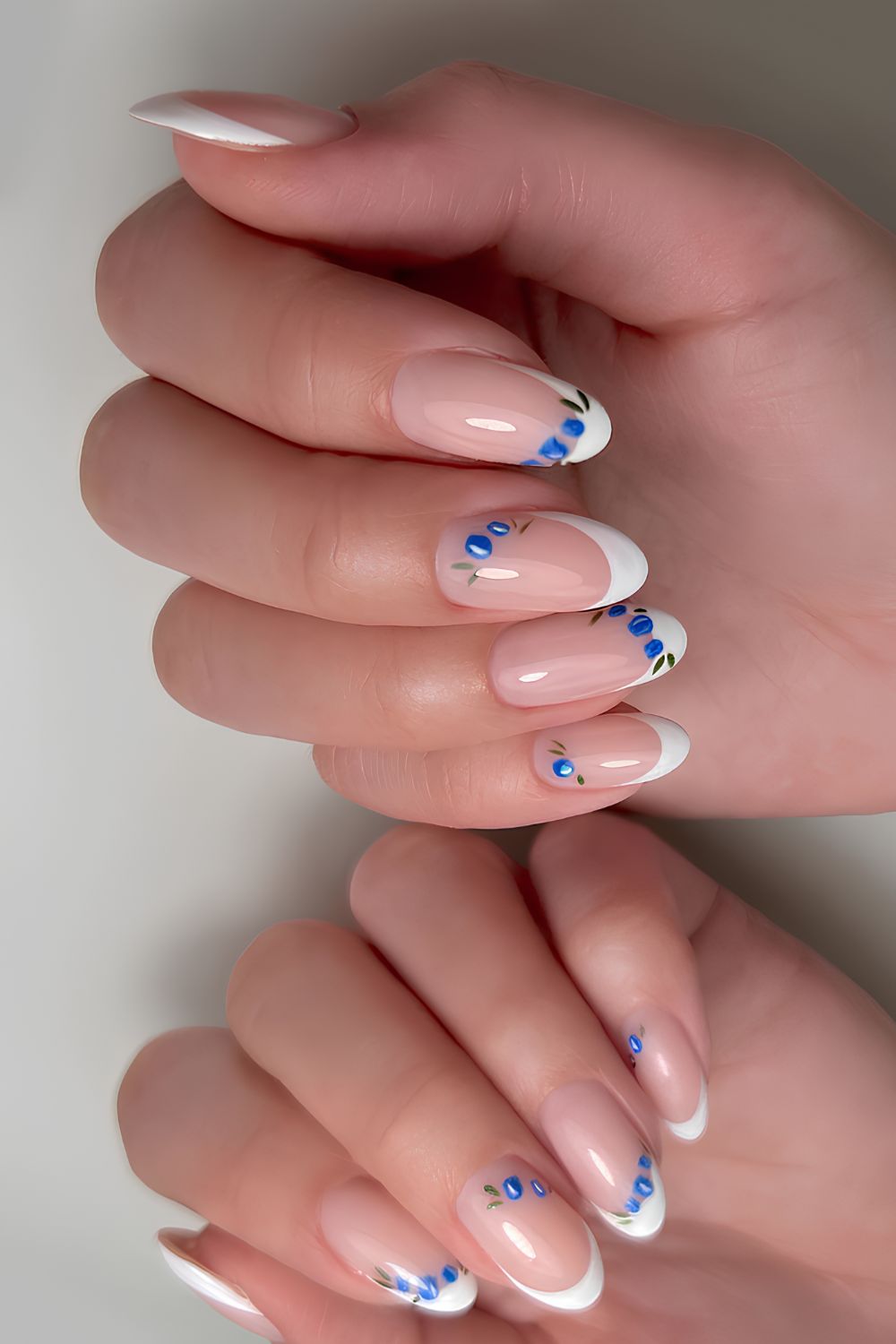 White French nails with blueberry art